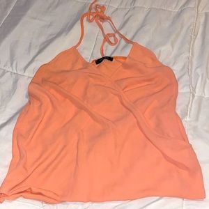Orange open back tank top.